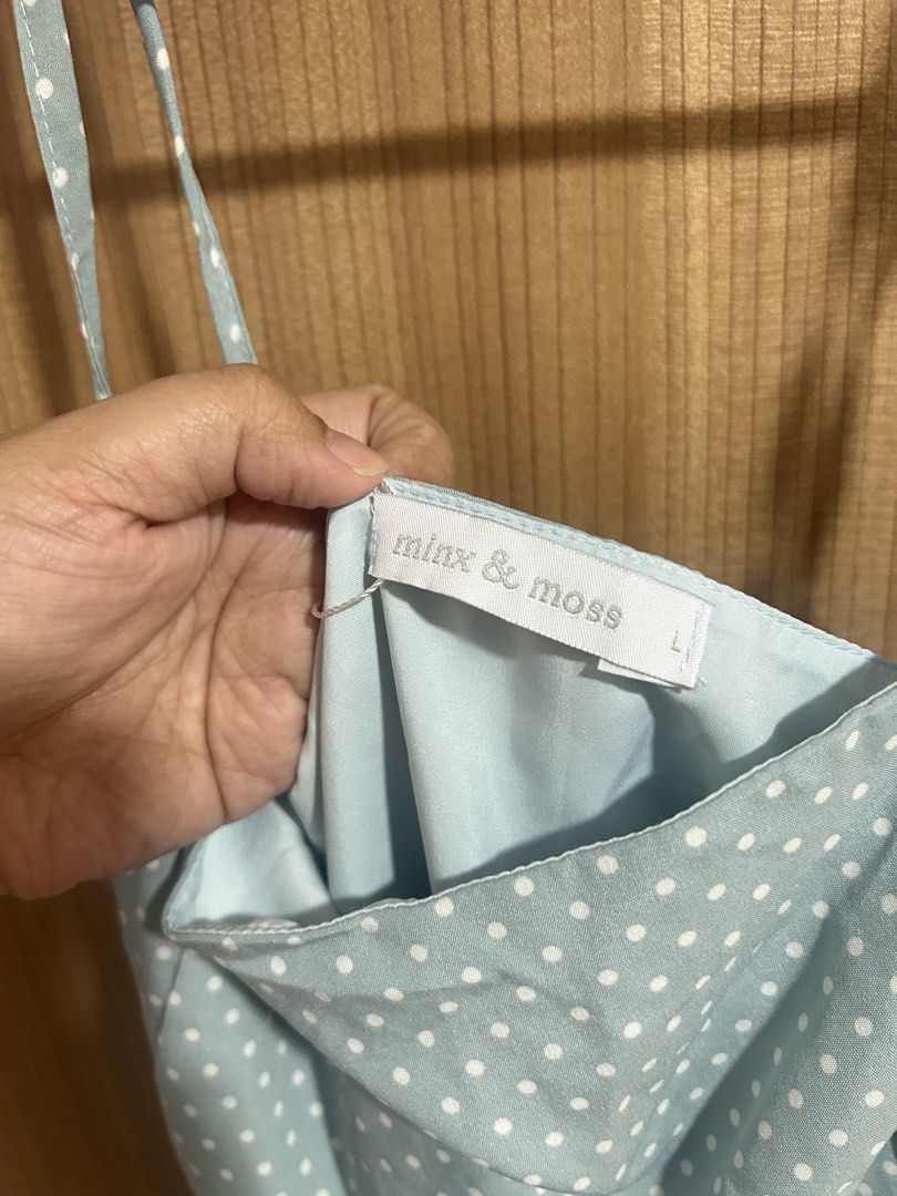 Minx & Moss Blue Polka Dot Spaghetti Strap Top (Category: Sleeveless) located in Taguig. Submitted by fastflower.02faa3 (Listing ID 1465060344, Image 2). Description: - Brand: Minx & Moss - Color/Pattern: Light blue with white polka dots - Style: Spaghetti strap cami with a peplum ruffle hem - Size: L (tag attached) - Condition: Great for casual days out.