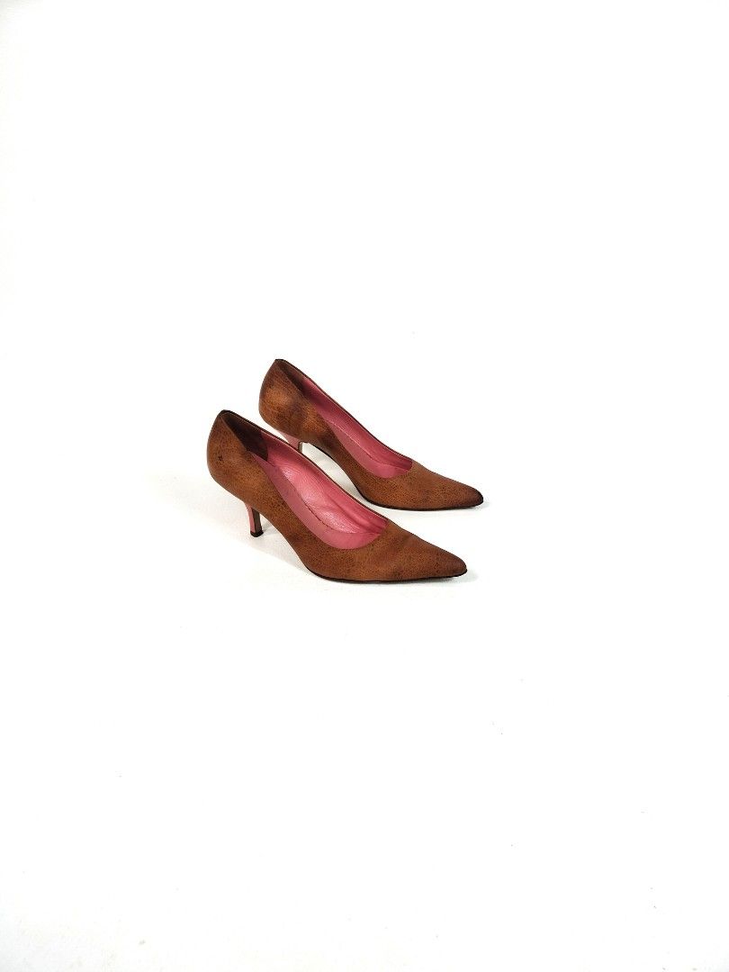 Miu Miu Brown Leather Pumps (Category: Heels) located in Manila. Submitted by callmetin (Listing ID 1465170504, Image 1). Description: - Brand: Miu Miu - Style: Pointed-toe slip-on pumps with slim heel - Material: Brown textured leather with visible grain pattern - Interior: Vibrant bright pink lining with silver stamped logo and 'Made in Italy' tag - Condition: Excellent pre-loved condition - Perfect for work, events, or casual chic looks.
