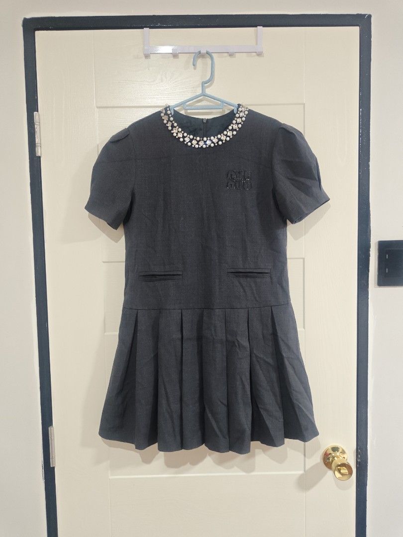 Miumiu Gray Dress (Category: Luxury Apparel) located in Santa Rosa. Submitted by sassycollection. (Listing ID 1465017936, Image 2). Description: Decluttering luxury dressed Gray color Studded in neck collar Skirt style Innerlining inside Can fit to small up to medium.
