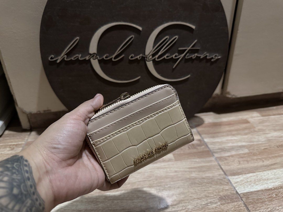 MK coin purse & card holder (Category: Wallets & Card holders) located in Pasig City. Submitted by chamelvillanueva (Listing ID 1464981303, Image 2). Description: 1. MK zip around coin purse & card holder in beige/nude croc design ₱3,000.00 2. MK coin purse with key ring holder in mono brown signature and yellow combination design ₱2,800.00 2. MK coin purse with key ring holder in mono vanilla signature and brown combination design ₱2,800.00 -all