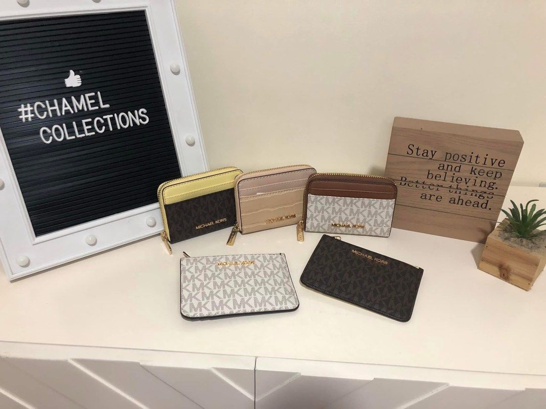 MK coin purse & card holder (Category: Wallets & Card holders) located in Pasig City. Submitted by chamelvillanueva (Listing ID 1464981303, Image 1). Description: 1. MK zip around coin purse & card holder in beige/nude croc design ₱3,000.00 2. MK coin purse with key ring holder in mono brown signature and yellow combination design ₱2,800.00 2. MK coin purse with key ring holder in mono vanilla signature and brown combination design ₱2,800.00 -all
