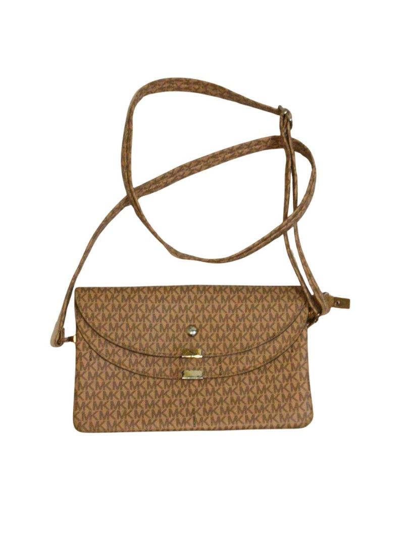 MK Monogram Crossbody Bag Brown (Category: Luxury Bags & Wallets) located in Cavite. Submitted by stylewithnics (Listing ID 1465031860, Image 1). Description: - Brand: f@ke/dup3 - Brown MK monogram print all over - Long adjustable strap with secure metal hardware - Flap closure with front snap button detail - Compact size ideal for daily errands and quick outings - Clean edges and durable, sturdy construction.