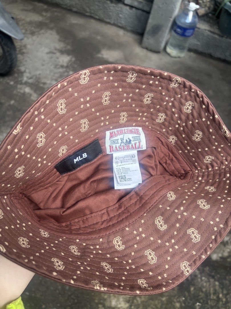 MLB Boston Red Sox Brown Bucket Hat (Category: Caps & Hats) located in Manila. Submitted by germainemaegarcia (Listing ID 1465005138, Image 3). Description: - Authentic MLB Boston Red Sox bucket hat - Color: Brown with embroidered 'B' logo on front and MLB logo on back - Size: 57 (Tag attached) - Material: 100% Cotton - Condition: Brand new / Excellent - Mode of Payment: GCash, or Bank Transfer - Shipping: Via J&T Express (Buyer shoulders shippin