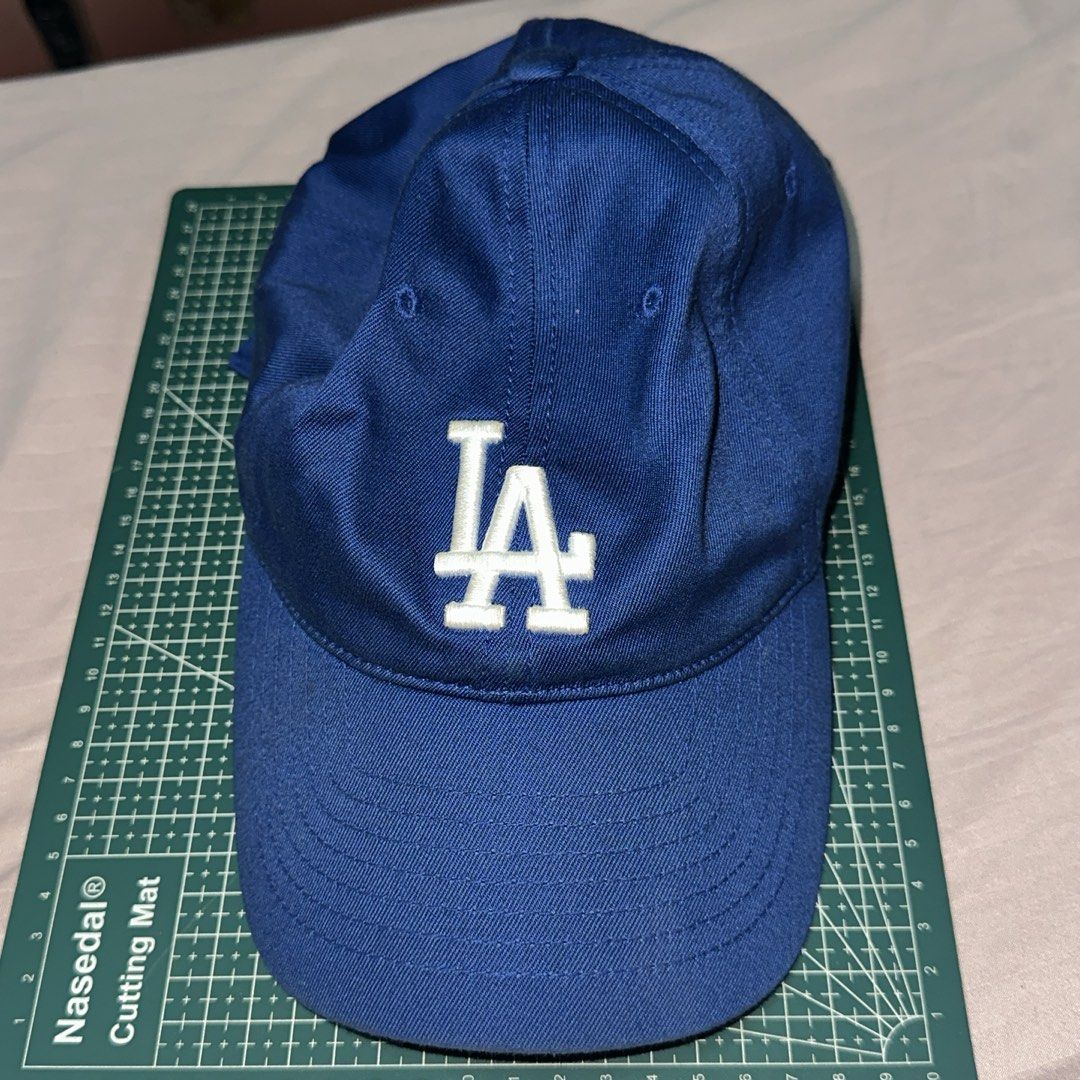 MLB Los Angeles Dodgers Blue Cap Hat (Category: Caps & Hats) located in Muntinlupa City. Submitted by seok08 (Listing ID 1465035826, Image 1). Description: - Authentic royal blue Los Angeles Dodgers baseball cap - Crisp white embroidered 'LA' logo on the front - Classic structured panels with a curved brim - Official MLB logo patch stitched above the adjustable back strap - Used for only less than 10 times - Bought from MLB HK for 280 HKD check @