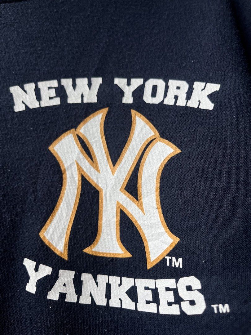 MLB New York Yankees Navy Blue Sweatshirt (Category: Coats, Jackets and Outerwear) located in Manila. Submitted by kingjamessthriftt (Listing ID 1465015663, Image 2). Description: - Official MLB New York Yankees crewneck sweatshirt - Color: Navy blue with white and gold team chest graphic - Material: Comfortable standard fit cotton blend - Details: Long sleeves, ribbed cuffs and hem - Authenticity: Features official Major League Baseball neck tag