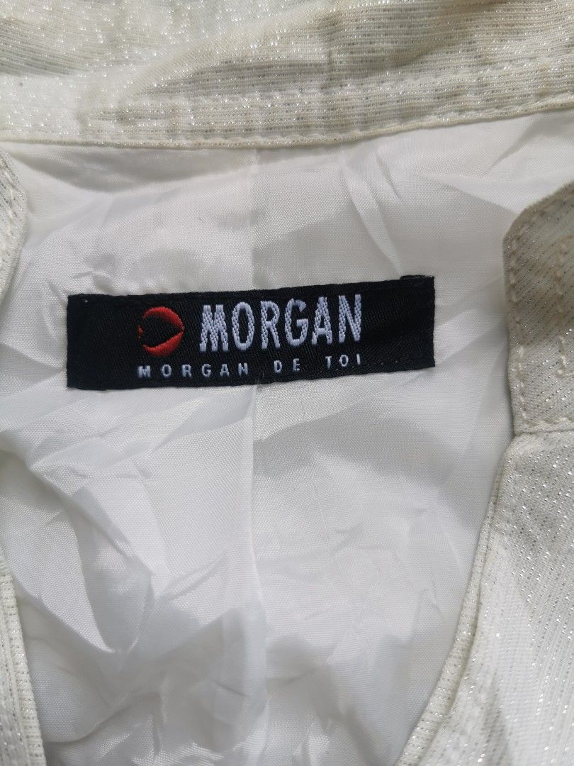 Morgan De Toi White Textured Jacket (Category: Coats, Jackets and Outerwear) located in Davao. Submitted by dmp1993 (Listing ID 1465037223, Image 2). Description: White textured jacket from Morgan De Toi. Decorative silver buttons down the front, including a heart-shaped top button. Puffed shoulders and flared peplum hem. Structured collar and buttoned cuff straps. Lined interior. Size 88-97-160 indicated on the tag..