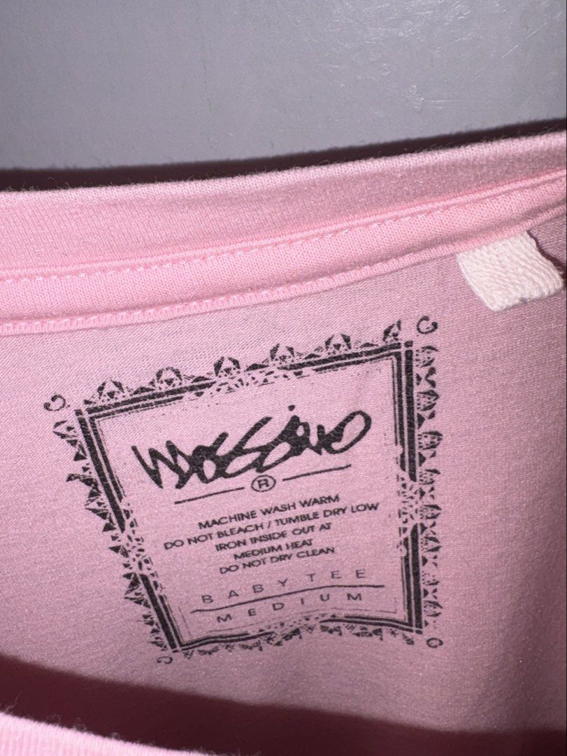 Mossimo 1986 Pink Baby Tee Medium (Category: Shirts) located in Manila. Submitted by margascloset_ (Listing ID 1465061495, Image 3). Description: - Pink | Medium - Design: Red printed 'MOSSIMO 1986' graphic - Details: Small black woven Mossimo logo tag on the left sleeve, printed collar tag - Fit: Short sleeves, round neckline RFS: Decluttering / no longer used MOD: J&t, LBC, Lalamove, Grab MOP: Gcash / Bank.
