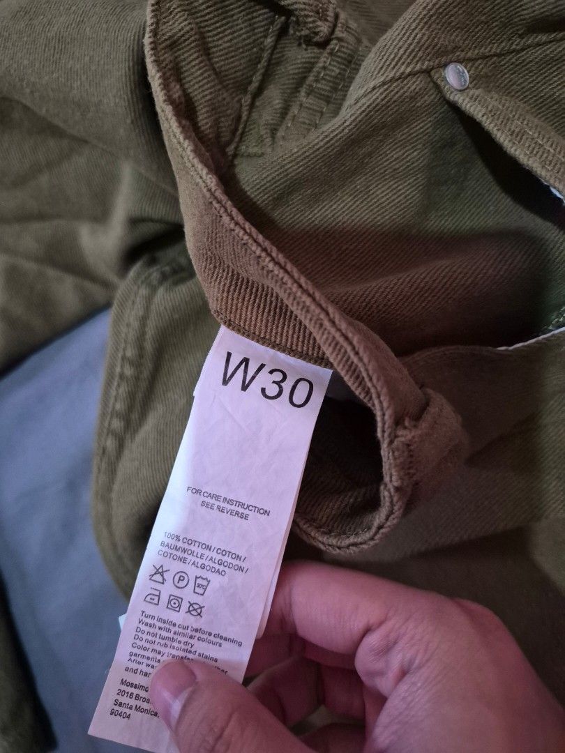 Mossimo Olive Green Denim Jeans (Category: Jeans) located in Bulacan. Submitted by mrk_mdl (Listing ID 1465164030, Image 3). Description: - Brand: Mossimo - Style: Straight leg denim jeans - Color: Olive green - Size: W30 - Material: 100% cotton - Closure: Classic button fly with metal hardware - Details: Branded leather patch on back waistband and black logo tab on rear pocket - Condition: Pre-loved / well-maintained - ankle length.