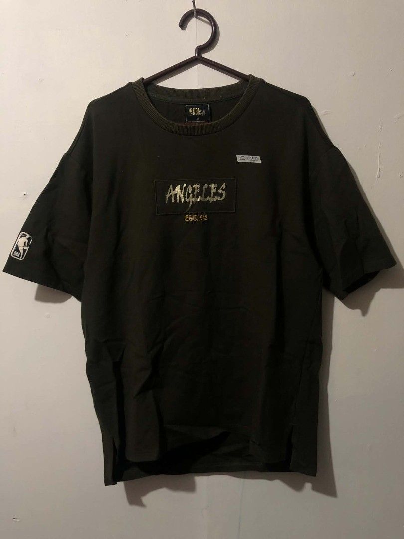 NBA Lakers Olive Green Shirt (Category: Tshirts & Polo Shirts ) located in Pasig City. Submitted by geloangelo17550 (Listing ID 1465152216, Image 2). Description: Authentic Excellent condition issue check last 2 pictures.