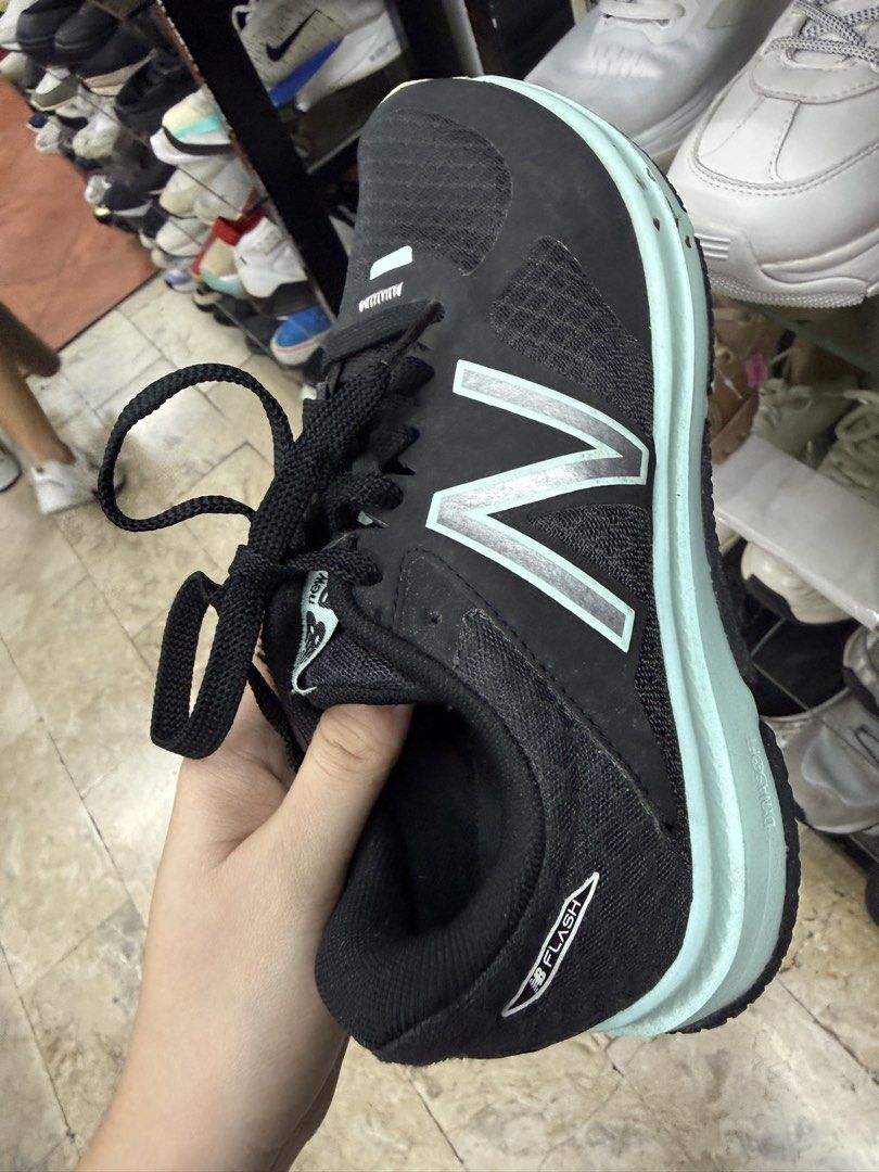 New Balance Flash Running Shoes Black Mint (Category: Sneakers) located in Manila. Submitted by fastlion.584bdf (Listing ID 1465072025, Image 1). Description: - Brand: New Balance running shoes - Color: Black and light mint green - Size: Standard fit - Upper: Textured mesh for breathability - Cushioning: DynaSoft midsole for runs and gym sessions - Closure: Standard lace-up front - Condition: Traction pattern on the sole shows some wear.