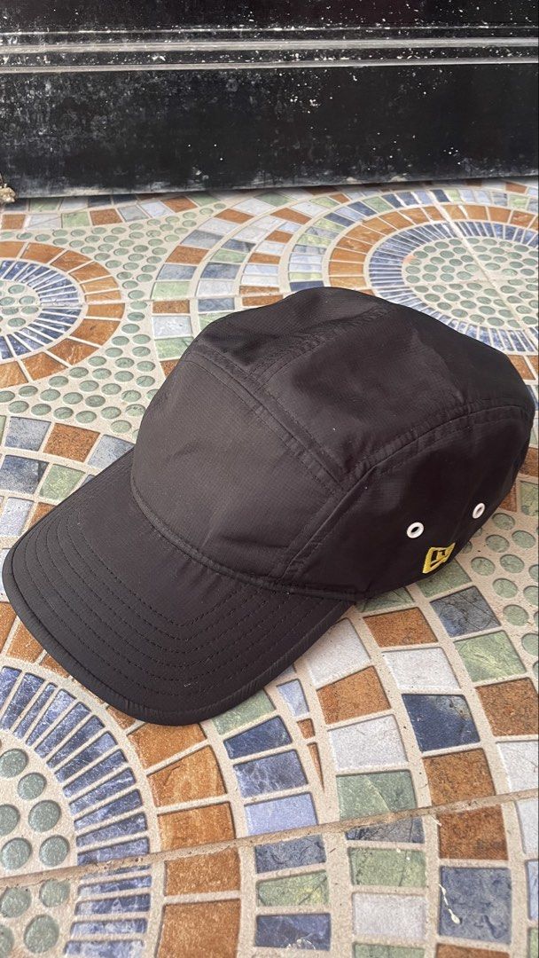New Era 5-Panel Camper Cap (Category: Caps & Hats) located in Naga. Submitted by real_gie (Listing ID 1464980048, Image 1). Description: New Era 5-Panel Camper Cap (Jet Cap) • Classic 5-panel layout with a flat front brim •Iconic gold/yellow New Era logo embroidered on the side •Breathable metallic side eyelets + fully adjustable back strap • Free size (Adjustable / One Size Fits Most) •Black • Condition: 9.8/10 Price: ₱1,800 slightly negotiable 