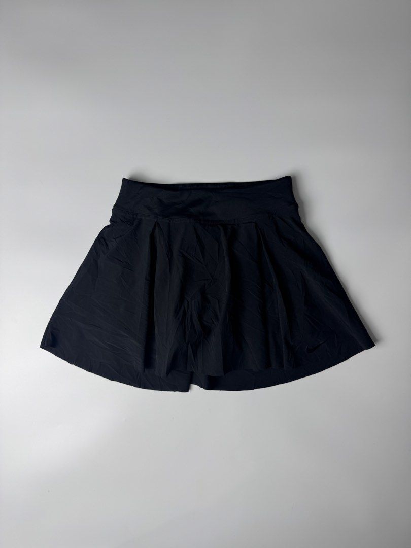 Nike Dri-FIT Black Pleated Athletic Skort (Category: Skirts) located in Manila. Submitted by babygirly2k (Listing ID 1465081443, Image 1). Description: - Brand: Nike - Item: Athletic Skort - Color: Black - Size: Extra Small (XS) - Material: Polyester and spandex blend with Dri-FIT moisture-wicking technology - Features: Built-in shorts with side pocket, reflective stripe detail, and pleated skirt design - Origin: Made in Cambodia - Style Code: DB