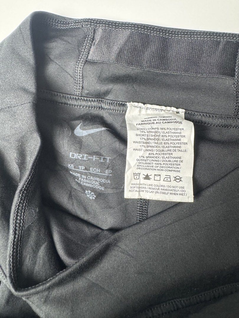 Nike Dri-FIT Black Pleated Athletic Skort (Category: Skirts) located in Manila. Submitted by babygirly2k (Listing ID 1465081443, Image 3). Description: - Brand: Nike - Item: Athletic Skort - Color: Black - Size: Extra Small (XS) - Material: Polyester and spandex blend with Dri-FIT moisture-wicking technology - Features: Built-in shorts with side pocket, reflective stripe detail, and pleated skirt design - Origin: Made in Cambodia - Style Code: DB