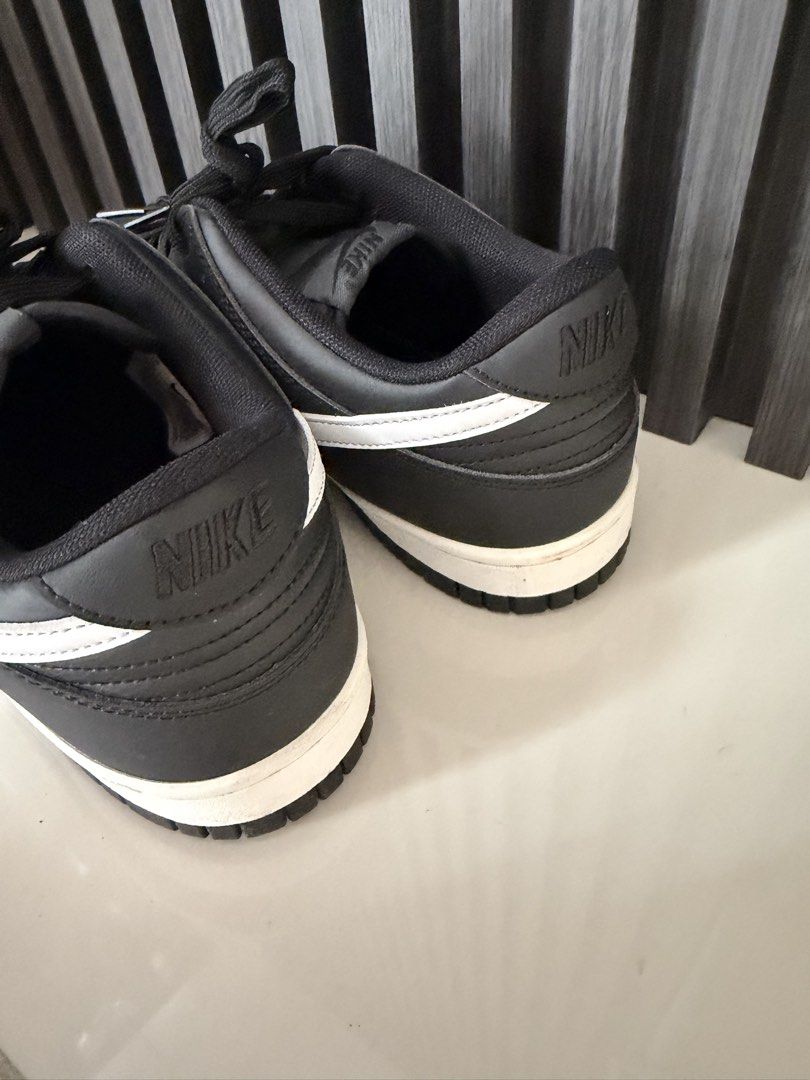 Nike Dunk Low Panda Black White (Category: Sneakers) located in Manila. Submitted by purestar.01 (Listing ID 1465169003, Image 3). Description: - Model: Nike Dunk Low (Classic Panda Colorway) - Color: Black and white with a matching white midsole and swoosh - Material: Durable leather upper and rubber outsole - Condition: Pre-owned with minor dirt on the outsoles from light wear - Style: Classic low-top basketball silhouette - Inclusions: Standar