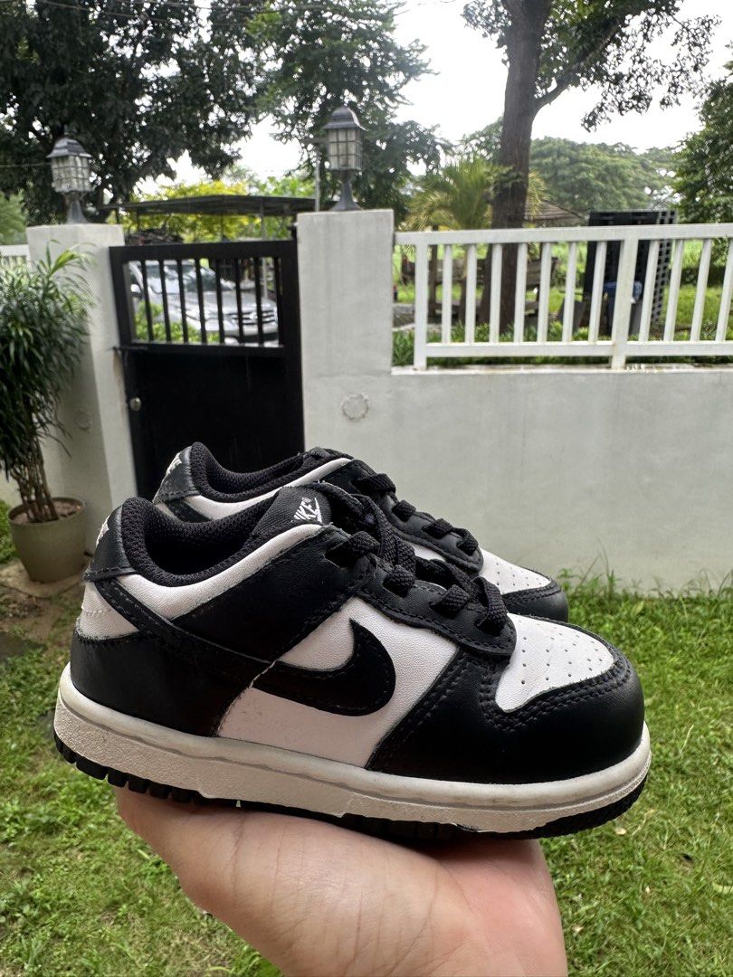 Nike Dunk Low Panda Toddler Shoes (Category: Babies & Kids Fashion) located in Bulacan. Submitted by thriftbagcollections (Listing ID 1465057522, Image 2). Description: - Classic black and white panda colorway in a low-top style - White leather base with black overlays and matching black laces - Durable black rubber outsole underneath - Standard lace-up closure for a secure fit.