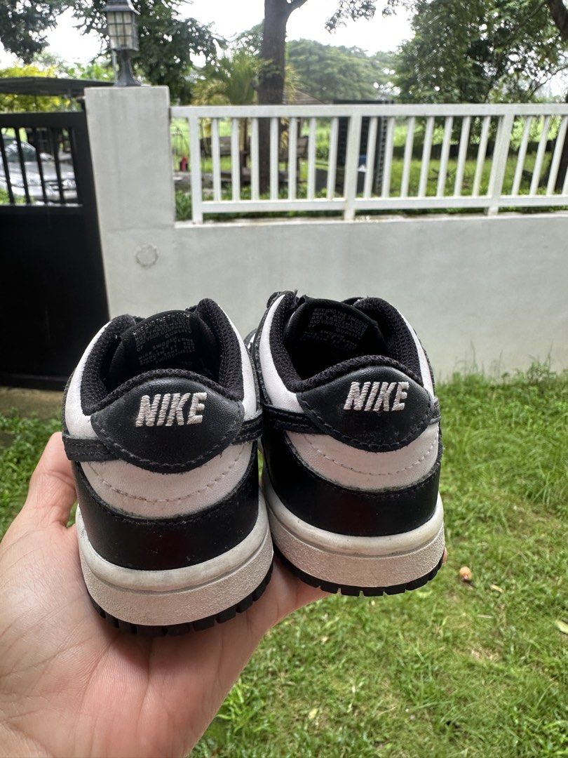 Nike Dunk Low Panda Toddler Shoes (Category: Babies & Kids Fashion) located in Bulacan. Submitted by thriftbagcollections (Listing ID 1465057522, Image 3). Description: - Classic black and white panda colorway in a low-top style - White leather base with black overlays and matching black laces - Durable black rubber outsole underneath - Standard lace-up closure for a secure fit.