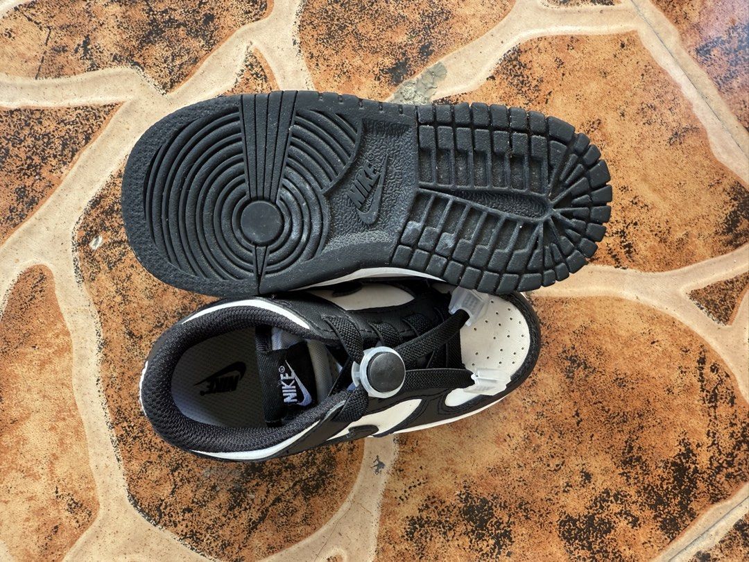 Nike Dunk Low Panda Toddler Size 8C (Category: Babies & Kids Fashion) located in Pasig City. Submitted by christinevino (Listing ID 1465030505, Image 2). Description: - Size: US 8C (interior tag clearly readable) - Colorway: Classic black and white (panda style) - Feature: Elastic no-tie laces for easy slip-on and off - Condition: like new, great for everyday toddler use.