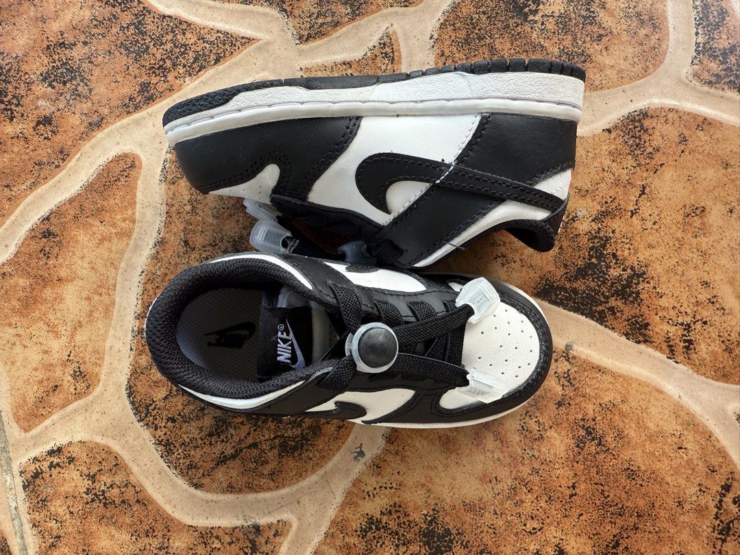Nike Dunk Low Panda Toddler Size 8C (Category: Babies & Kids Fashion) located in Pasig City. Submitted by christinevino (Listing ID 1465030505, Image 3). Description: - Size: US 8C (interior tag clearly readable) - Colorway: Classic black and white (panda style) - Feature: Elastic no-tie laces for easy slip-on and off - Condition: like new, great for everyday toddler use.