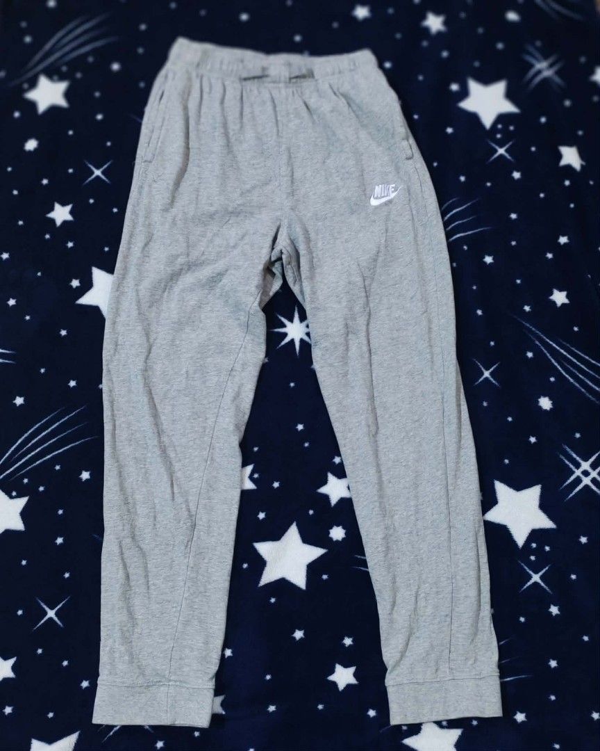Nike Grey Joggers Sweatpants (Category: Joggers) located in Sipalay. Submitted by boldowl.e4f283 (Listing ID 1465008203, Image 1). Description: - Brand: Nike - Color: Grey - Features: Elastic waistband, ribbed cuffs, and two side pockets - Details: Small white embroidered Nike logo on upper left leg - Best for: Everyday casual wear, lounging, or working out - Condition: Excellent / Pre-loved (as applicable).