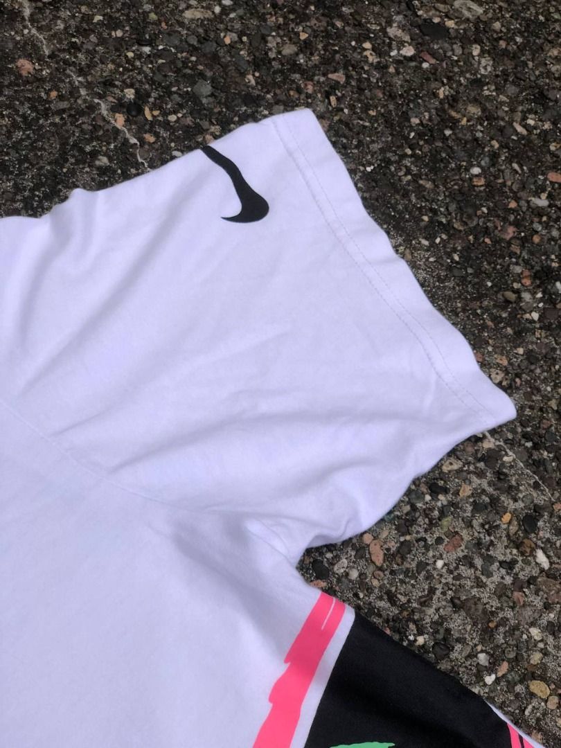 Nike Just Do It Graphic Tee (Category: Tshirts & Polo Shirts ) located in Tacloban City. Submitted by thedropout (Listing ID 1465051561, Image 2). Description: - Brand: Nike - Style: Graphic t-shirt - Size: Medium - Color: White - Details: Big multi-color swoosh logo with neon green 'Just Do It' text on the front - Sleeve: Small black swoosh printed on the left sleeve - Fit/Material: Classic crew neck, clean cotton build - Condition: Easy everyda