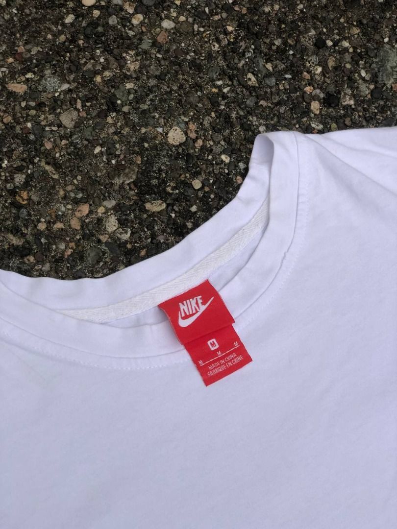 Nike Just Do It Graphic Tee (Category: Tshirts & Polo Shirts ) located in Tacloban City. Submitted by thedropout (Listing ID 1465051561, Image 3). Description: - Brand: Nike - Style: Graphic t-shirt - Size: Medium - Color: White - Details: Big multi-color swoosh logo with neon green 'Just Do It' text on the front - Sleeve: Small black swoosh printed on the left sleeve - Fit/Material: Classic crew neck, clean cotton build - Condition: Easy everyda