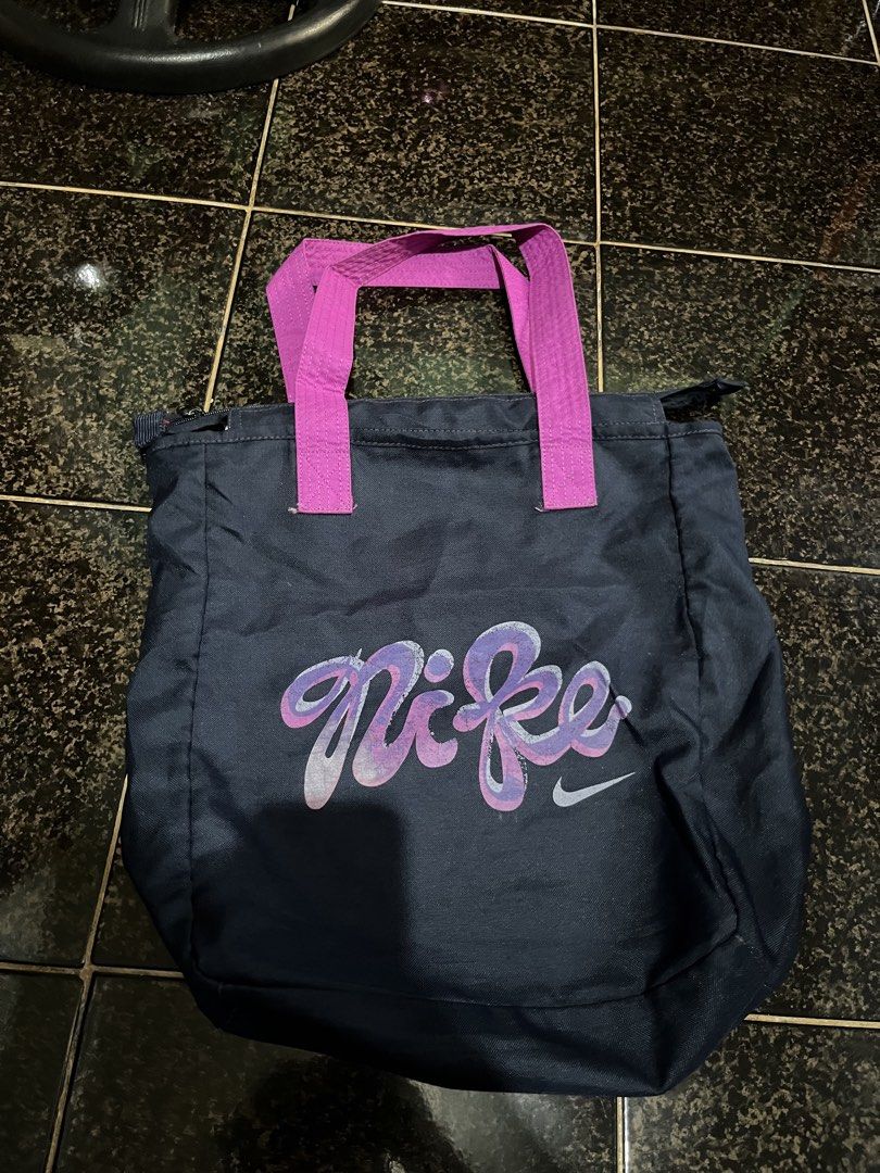 Nike Navy Tote Bag With Pink Straps (Category: Tote Bags) located in Cavite. Submitted by pipziness1025 (Listing ID 1464977439, Image 1). Description: Original Nike tote bag Used but not abused .