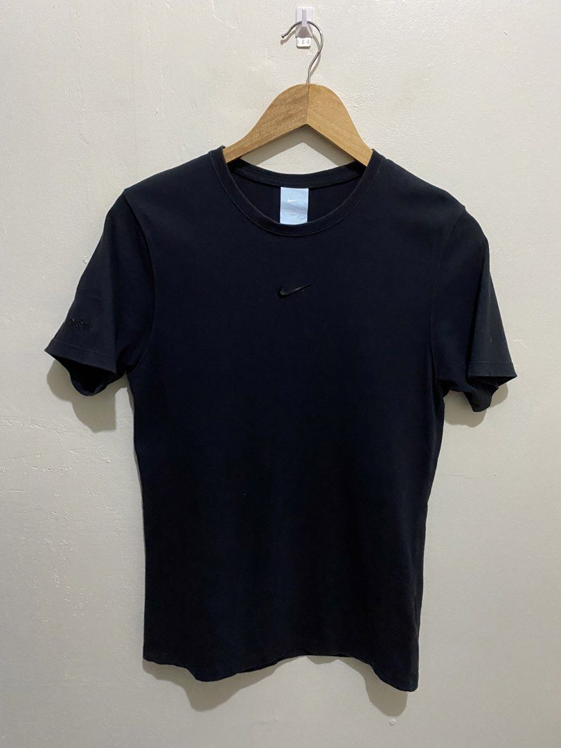 Nike x NOCTA Black T-Shirt (Category: Tshirts & Polo Shirts ) located in Cainta. Submitted by mars_olavere (Listing ID 1465099749, Image 1). Description: Nike x NOCTA black crewneck t-shirt. Small tonal Nike swoosh on the chest. NOCTA branding printed on one sleeve, A.W.R. text on the other sleeve. Standard fit, soft cotton material. Clean look, goes with everything. Neck tag includes Nike and NOCTA details..