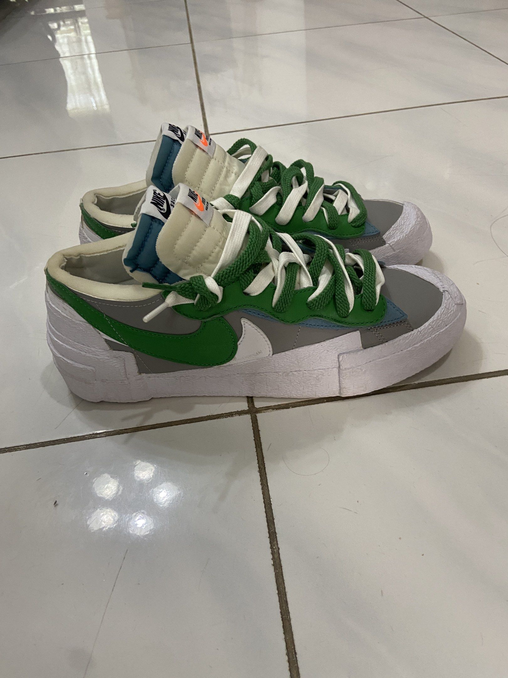 Nike x Sacai Blazer Low Green Grey (Category: Sneakers) located in Pilar. Submitted by romeoabejo54125 (Listing ID 1464984241, Image 3). Description: - Model: Nike x Sacai Blazer Low - Colorway: Pine Green / Medium Grey / White - Key Features: Signature double tongues, dual laces, layered swooshes, and stacked midsole design - Style: Low-top streetwear sneaker - Condition: Brand new / Pristine (ready to wear) - Mode of Payment: GCash, bank transf