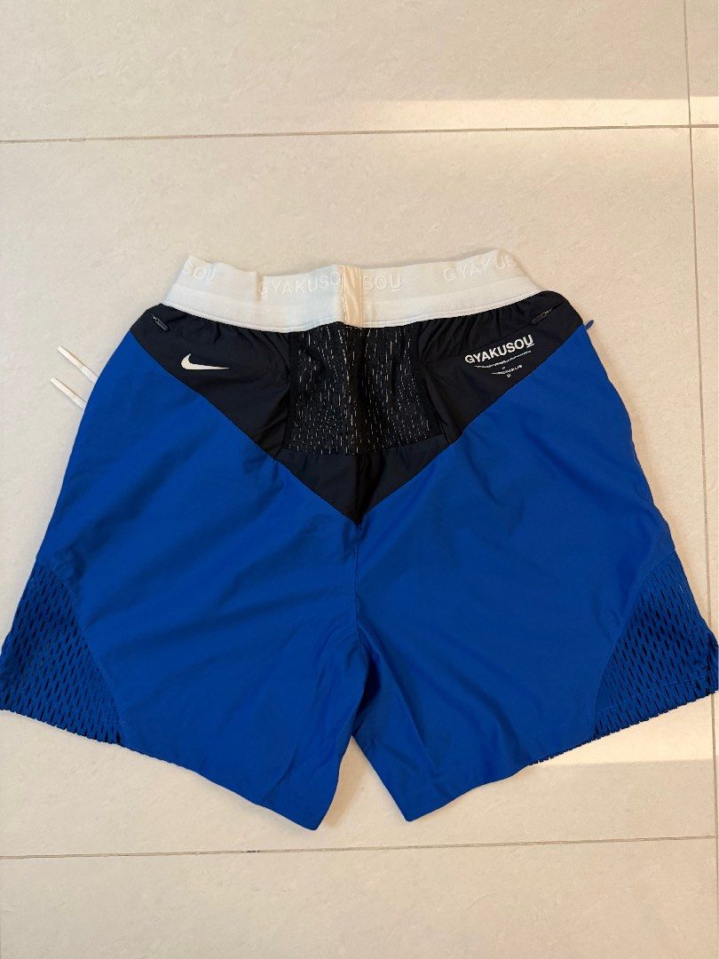 (Free SF) Nike x Undercover Gyakusou Running Shorts SizeM （分類：短褲）位於 Hong Kong。 由 extra_piece_of_fish 提交（商品編號 1465114430，圖片 2）。簡介： Nike x Undercover Gyakusou running shorts. Blue and black colorway with white elastic waistband bearing GYAKUSOU text. White drawstring closure. Mesh ventilation panels at sides and back. Small zip pockets at the back waist. GIRA logo printed on the front leg. Nike swoosh branding on the rear.。