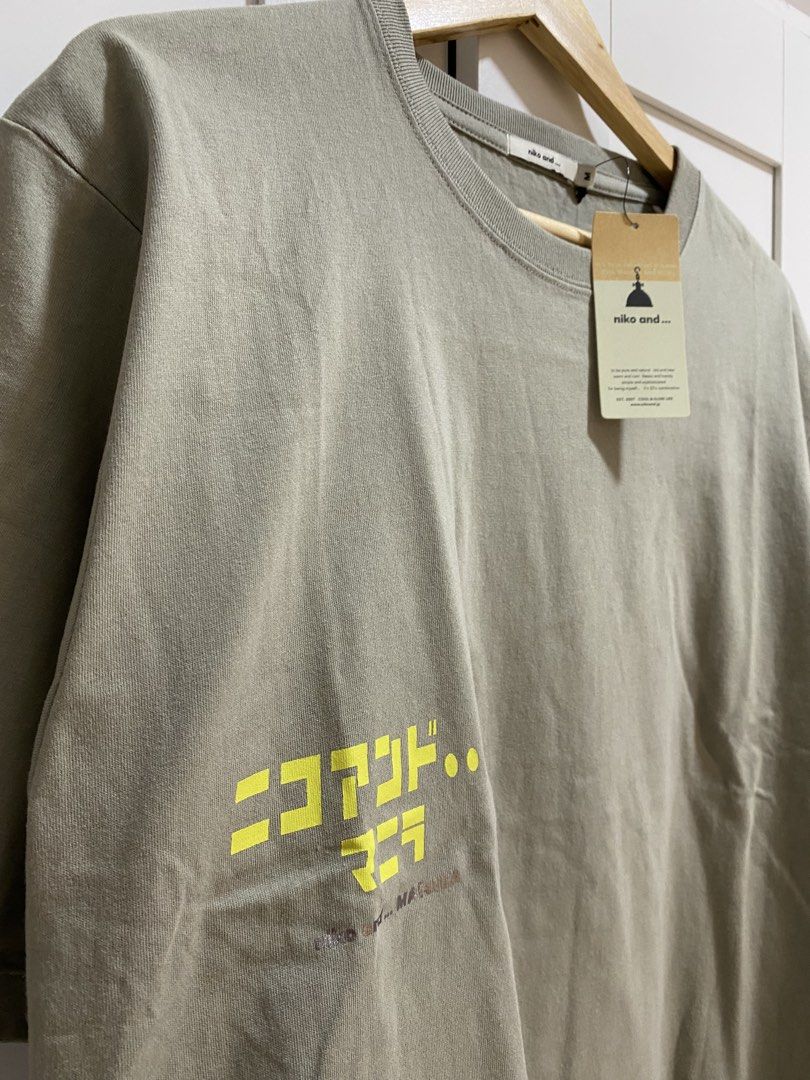 Niko and... Manila Olive Green Size M (Category: Tshirts & Polo Shirts ) located in Quezon City. Submitted by wearhouze (Listing ID 1465076072, Image 2). Description: - Brand: Niko and... - Color: Olive Green - Condition: Brand new with original tags attached - Material: 100% Cotton - Fit: Relaxed fit with short sleeves and ribbed crew neckline - Design: Japanese text on the front chest and diamond box graphic on the upper back.