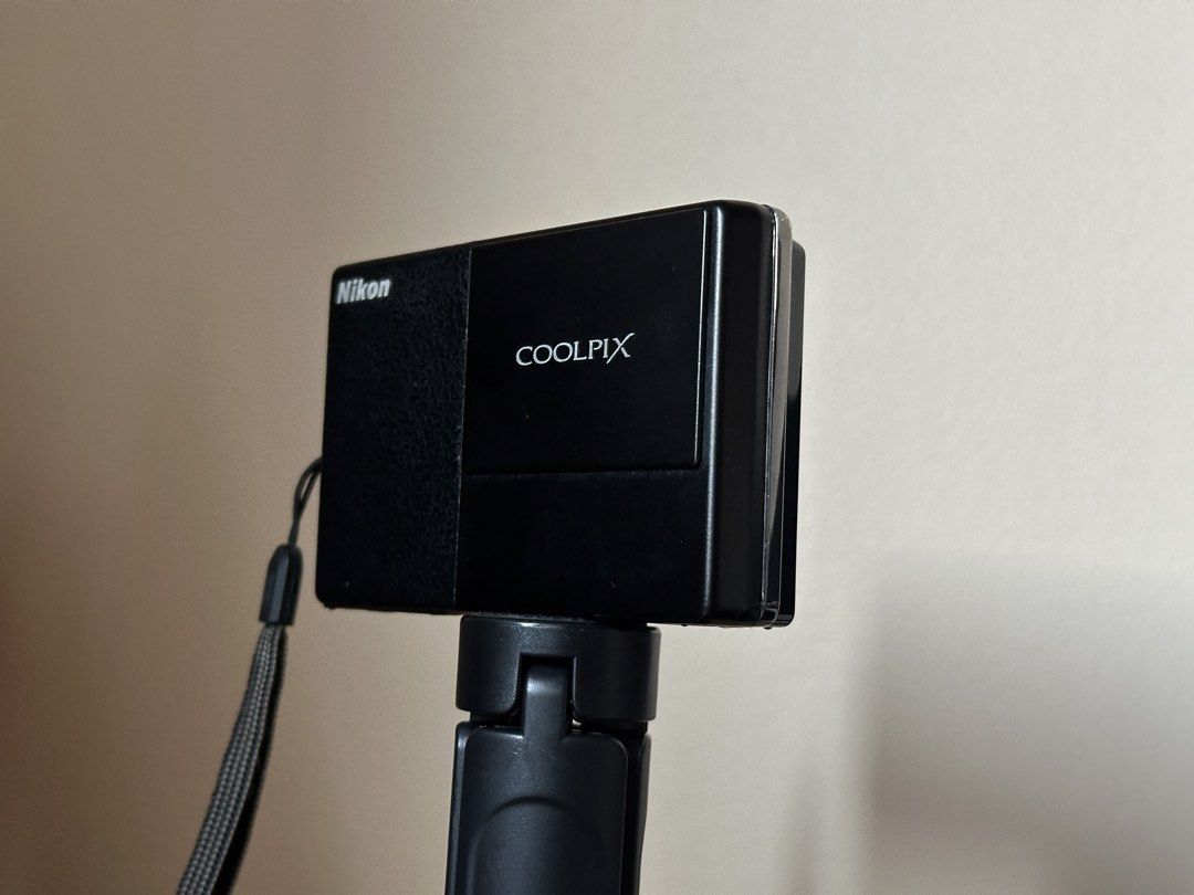 Nikon Coolpix S70 (DIGICAM) (Category: Cameras) located in Batangas. Submitted by jedeclutters (Listing ID 1465169306, Image 2). Description: - Model: Nikon Coolpix Compact Digital Camera (Black) - Lens: Built-in Nikkor 5x wide optical zoom with Vibration Reduction (VR) - Display: Touch screen with easy on-screen menu controls - Design: Stylish black body with a textured front grip and sliding lens cover - Extras: Original wrist strap included - 