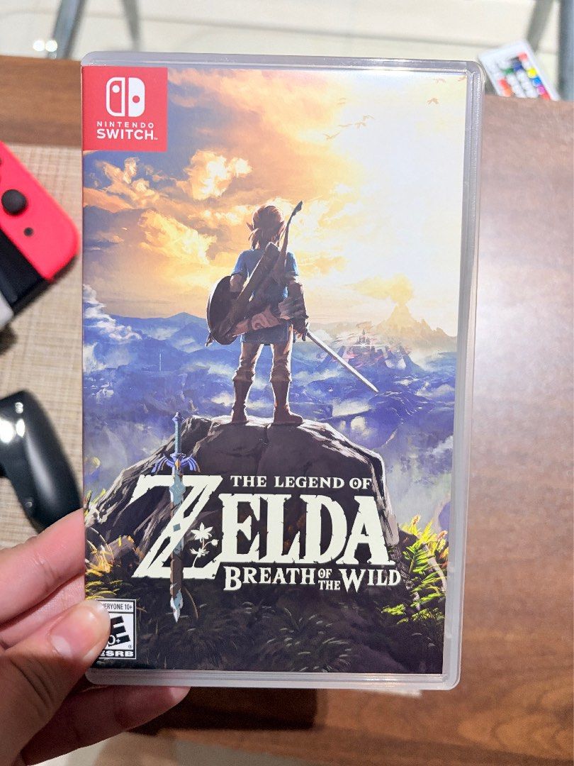 Nintendo Switch OLED Console with Games (used for 3 months only) (Category: Nintendo) located in Makati City. Submitted by mmmicka (Listing ID 1465073322, Image 2). Description: - Nintendo Switch Console (Neon Red & Blue) - used for 3 months - complete accessories - 4 Physical Game Cartridges: Stray, Animal Crossing New Horizons, The Legend of Zelda Breath of the Wild, and Nintendo Switch Sports - Complete bundle, dock included - No scratch - Com
