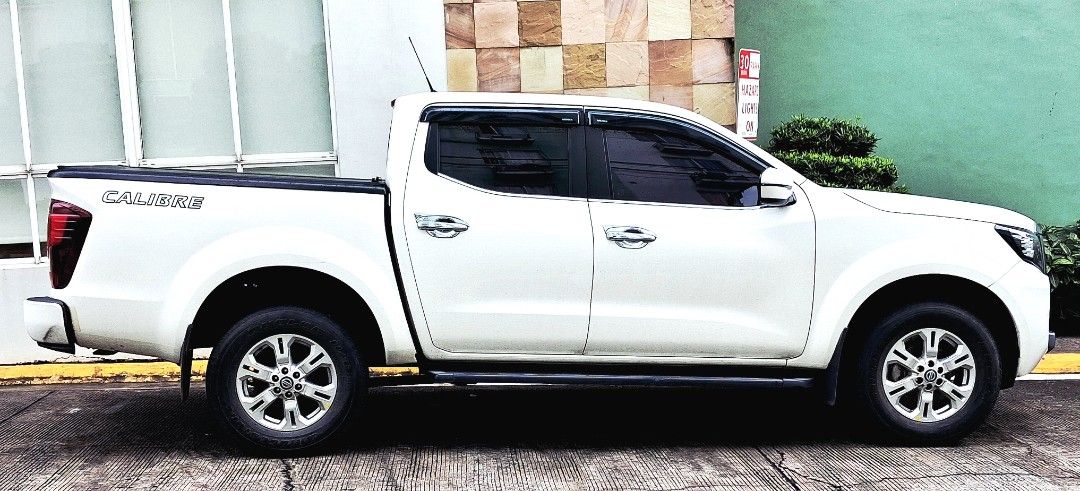 Nissan Navara VE 4x2 Auto (Category: Used Cars) located in Quezon City. Submitted by dlsb7 (Listing ID 1464978190, Image 3). Description: 2.5L, 4x2 April 2022 First owner REVOLVER bed cover Deep dish matting Comprehensive insurance w/AOG up to April 2027 Some minor dents/scratches Casa-maintained, just finished 40k PMS 1st owner No accident, never flooded Basement, covered parking RFS - moving to smaller vehicle Direct buyer encouraged.
