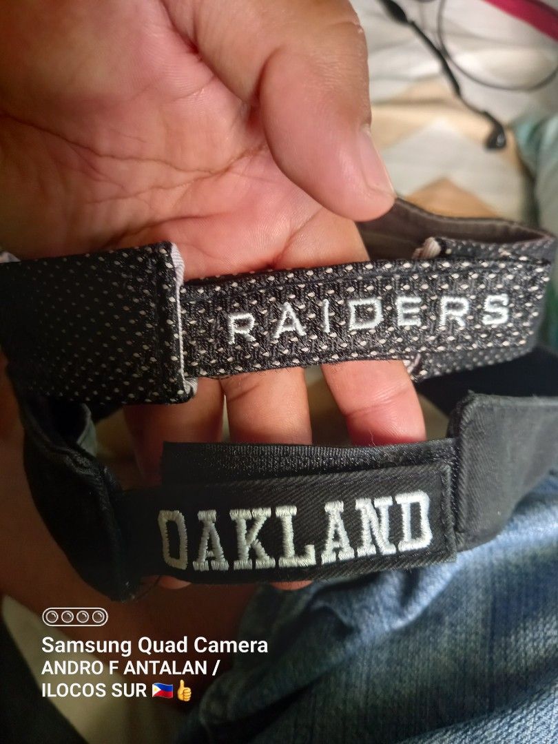 Oakland Raiders NFL Drew Pearson Visor Cap (Category: Caps & Hats) located in Narvacan. Submitted by drexantala78144 (Listing ID 1464984111, Image 3). Description: - Authentic Oakland Raiders sports visor by game day - Classic black color with stylish mesh detail - Embroidered team logo on the front and back strap - Adjustable hook-and-loop closure (One Size Fits All) - Easy care: hand wash cold - Great fan gear for game days and everyday wear.