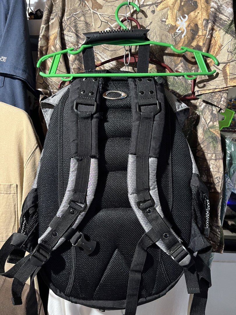 Oakley Icon Tactical Backpack Grey Black (Category: Backpacks) located in Cavite. Submitted by christianzuuu (Listing ID 1465112600, Image 2). Description: - may nirepair din na ibang butas kaya goods po - Brand/Style: Oakley Tactical Backpack - Color/Pattern: Grey and black - Durability: Heavy-duty buckle closures and rugged build - Storage: Multiple compartments and mesh side pockets - Comfort: Padded mesh back straps with adjustable support cl