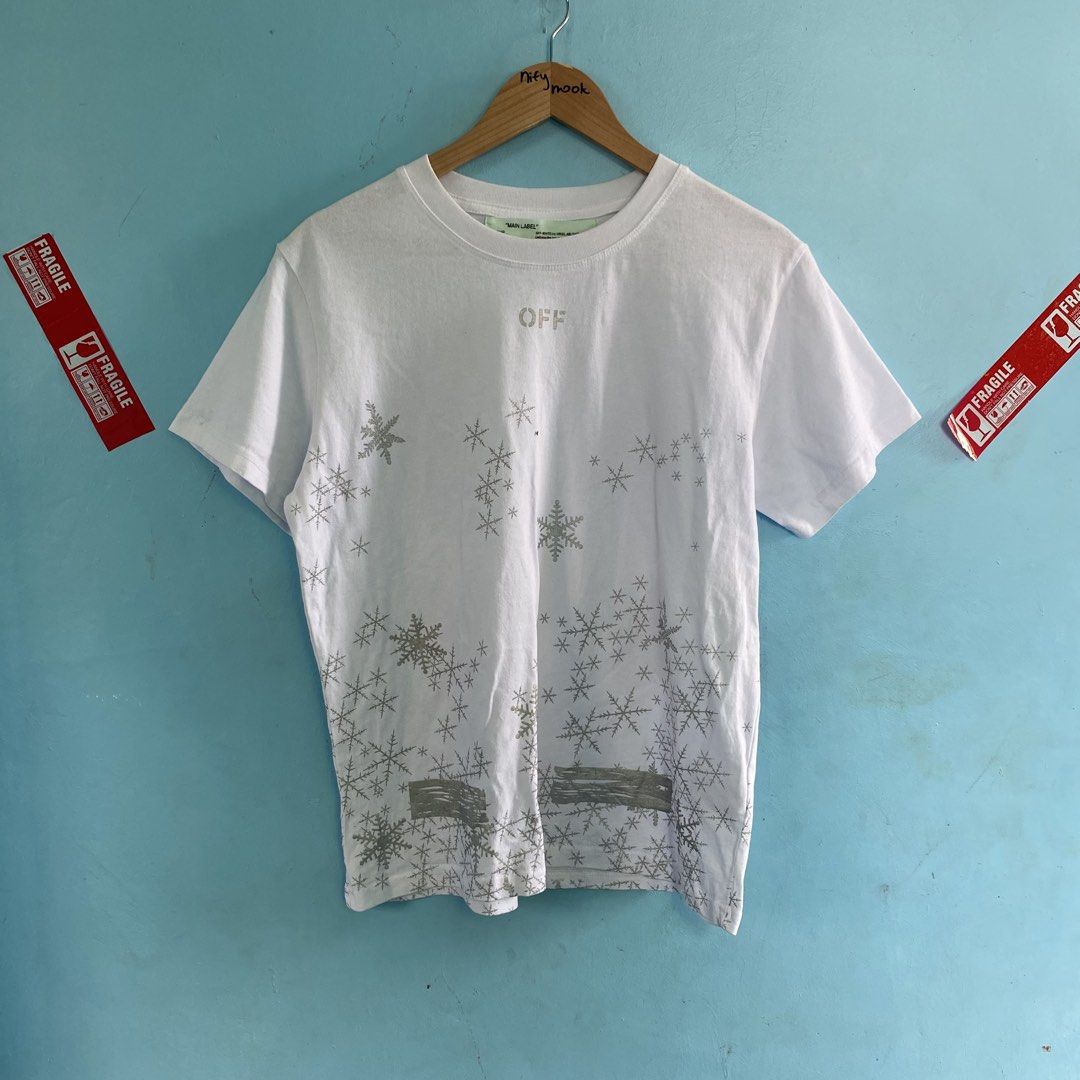 Off white snowflakes shirt (Category: Tshirts & Polo Shirts ) located in Santo Tomas. Submitted by niftynook_22 (Listing ID 1465015572, Image 1). Description: Excellent condition 9/10 color rate 20x26 No issue.