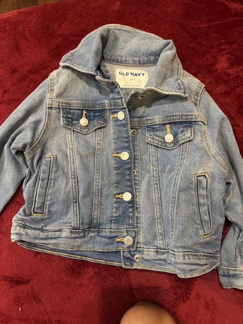 Old Navy Kids Denim Jacket Size 3T (Category: Babies & Kids Fashion) located in Manila. Submitted by karlaaricheta (Listing ID 1465081222, Image 1). Description: - Brand: Old Navy - Size: 3T - Color/Wash: Light wash denim - Style: Classic trucker jacket with structured collar and metal buttons - Pockets: Front chest pockets and side welt pockets - Details: Classic yellow contrast stitching - Condition: Great for layering over tees and sweaters.