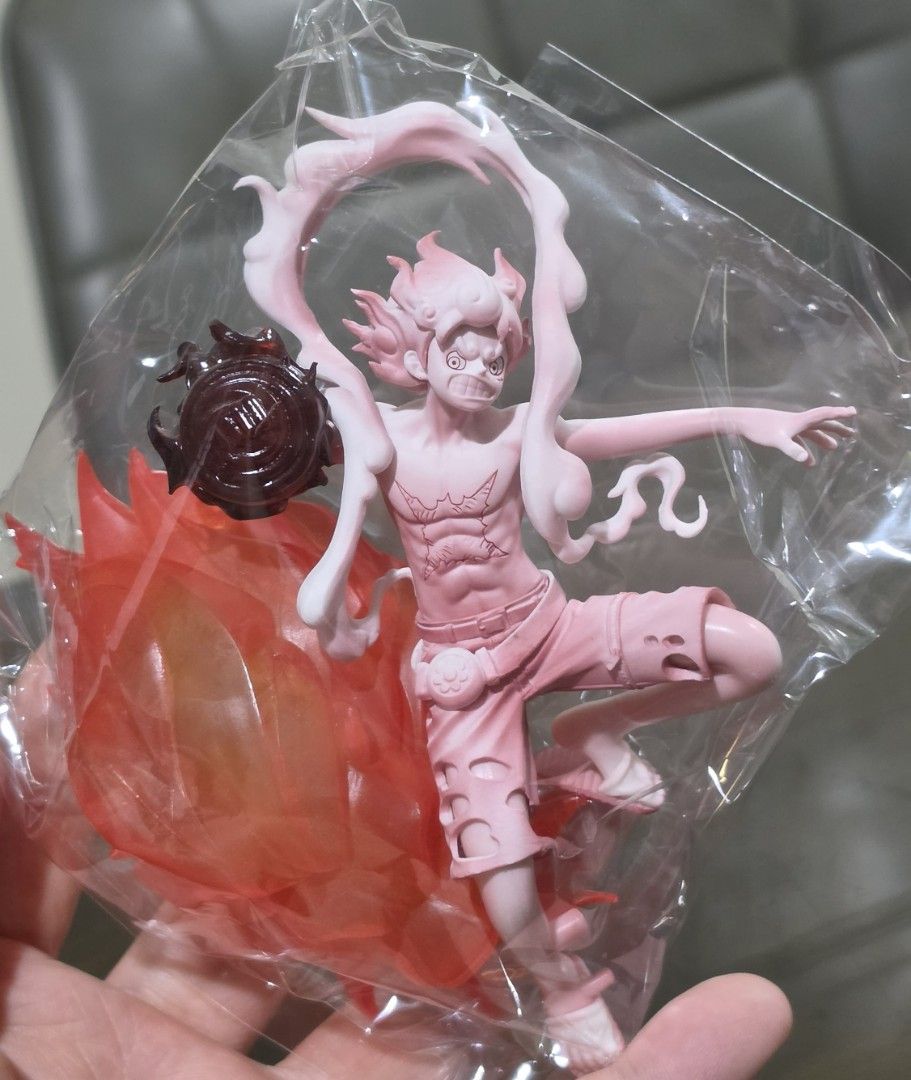 One Piece Luffy and Shanks Figurine Set (Category: Figurines & Statues) located in Taytay. Submitted by king_ayamiku (Listing ID 1465029672, Image 2). Description: - Set of 2 One Piece figures in special brush colorway - 1st Figure: Gear 5 Luffy with flame base and punch effect - 2nd Figure: Shanks with sword, blue lightning effect, and dark blue base - Condition: Brand new, still sealed inside original plastic packaging - Perfect addition for On