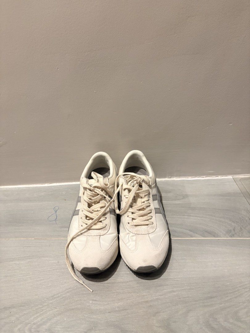 Onitsuka Tiger Sneakers White Grey (Category: Sneakers) located in Dasmarinas. Submitted by the_zoneshop.ph (Listing ID 1465122897, Image 1). Description: - Style: Vintage running silhouette in off-white with grey side stripes - Materials: Premium nylon and suede upper - Sole: Chunky rubber shark-tooth outsole with minimal wear - Details: Comfortable round laces - Condition: Clean all around, well-maintained everyday trainers - Used twice only.