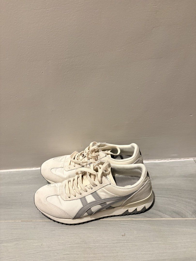 Onitsuka Tiger Sneakers White Grey (Category: Sneakers) located in Dasmarinas. Submitted by the_zoneshop.ph (Listing ID 1465122897, Image 2). Description: - Style: Vintage running silhouette in off-white with grey side stripes - Materials: Premium nylon and suede upper - Sole: Chunky rubber shark-tooth outsole with minimal wear - Details: Comfortable round laces - Condition: Clean all around, well-maintained everyday trainers - Used twice only.