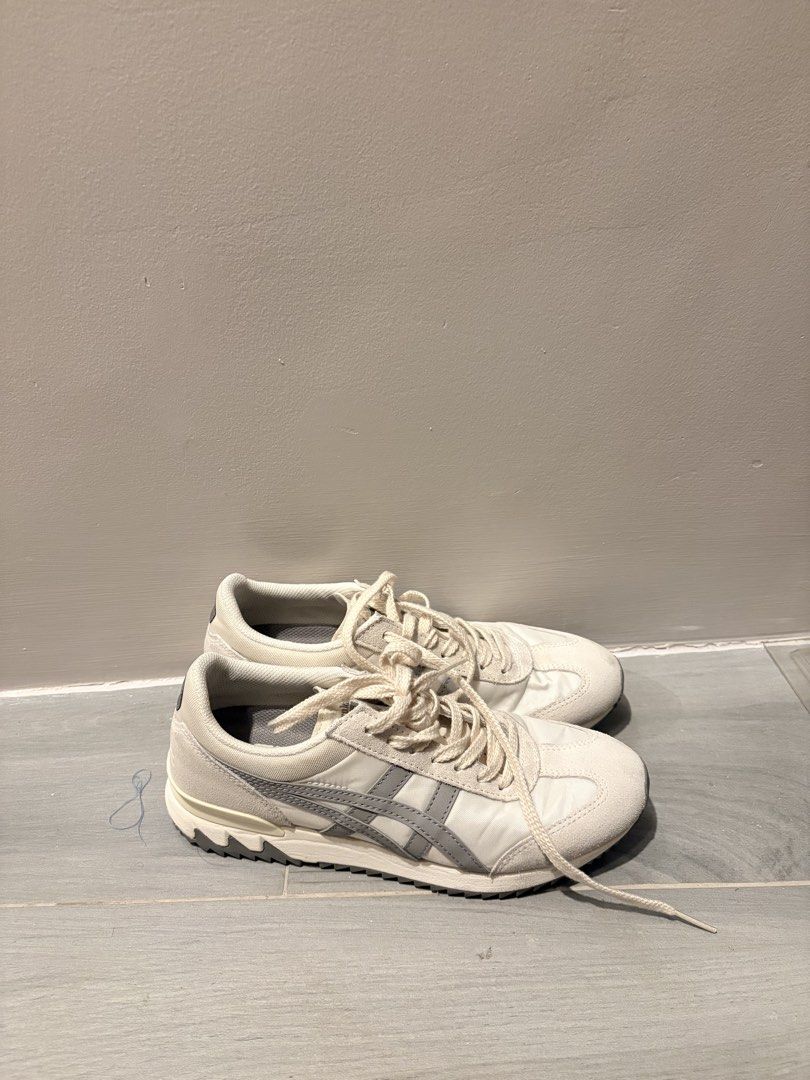 Onitsuka Tiger Sneakers White Grey (Category: Sneakers) located in Dasmarinas. Submitted by the_zoneshop.ph (Listing ID 1465122897, Image 3). Description: - Style: Vintage running silhouette in off-white with grey side stripes - Materials: Premium nylon and suede upper - Sole: Chunky rubber shark-tooth outsole with minimal wear - Details: Comfortable round laces - Condition: Clean all around, well-maintained everyday trainers - Used twice only.