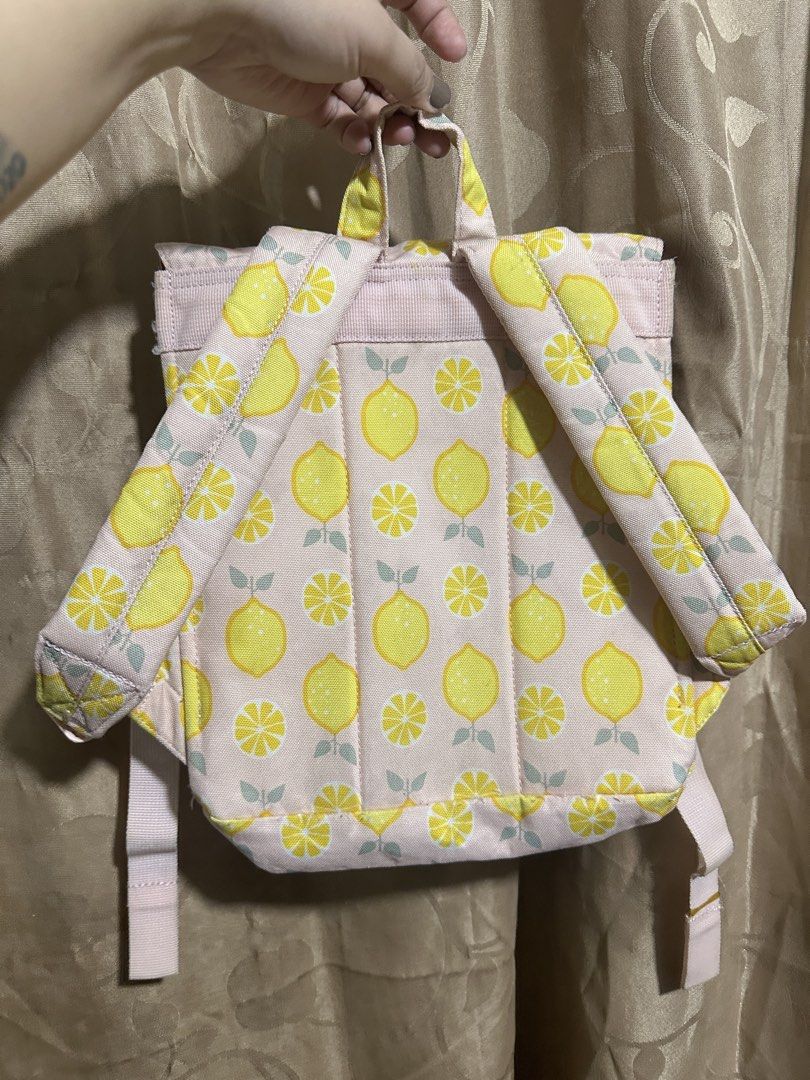 Original Herschel Supply Co. Nova Mini Backpack Lemon Print (Category: Kids Wardrobes & Storage) located in Manila. Submitted by edgiedge (Listing ID 1465056065, Image 3). Description: - 100% Authentic Herschel Supply Co. Nova Mini Backpack - Pastel pink straps, top handle, and magnetic snap buckles - well-maintained condition ₱400.