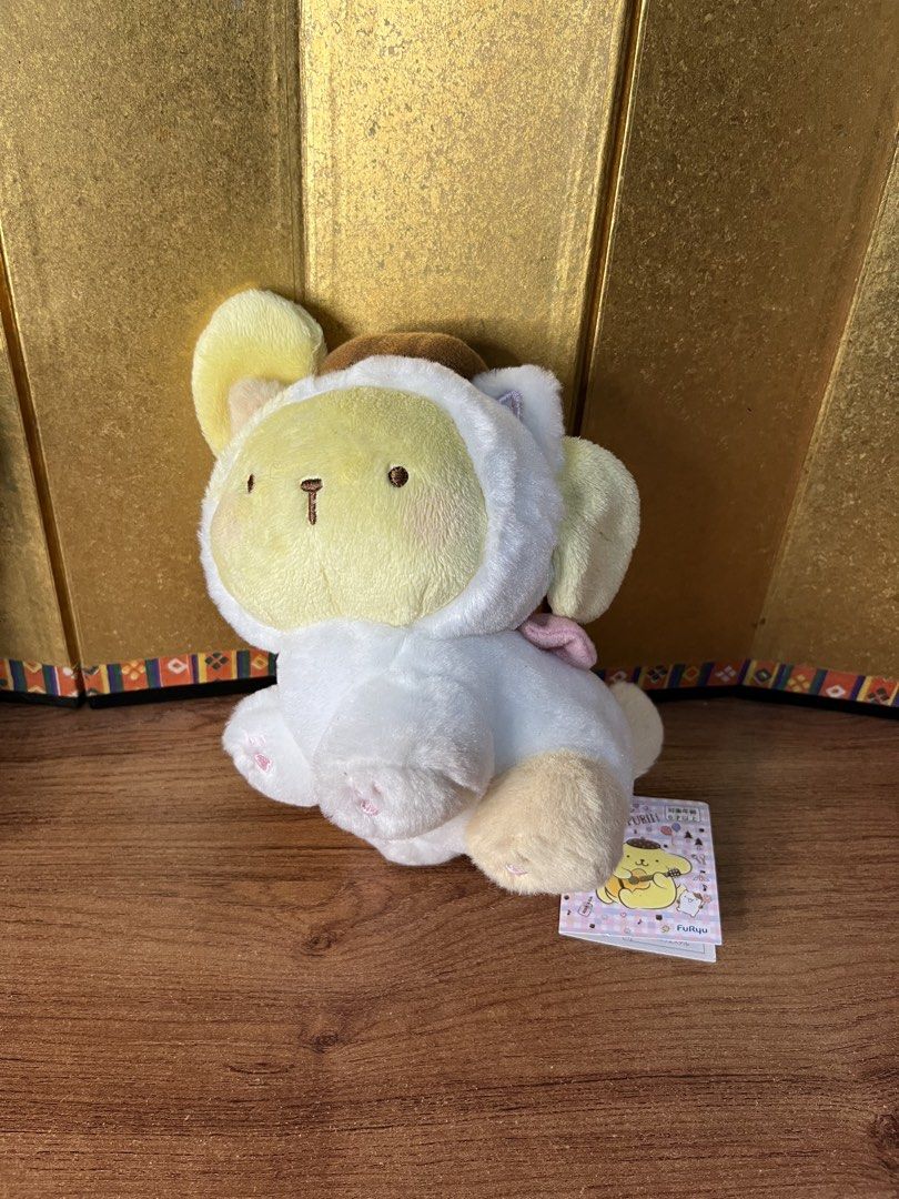 Original Sanrio Pompompurin Kitten Plush with Tag (Category: Plushies & Soft Toys) located in Gapan. Submitted by lunashop14 (Listing ID 1465156610, Image 1). Description: Original FuRyu Sanrio Pompompurin kitten plushie in pristine condition with original tags attached. Features a soft yellow and white design with a brown beret and pink bow. 100% authentic and super huggable. Perfect for collectors and gift-giving!.