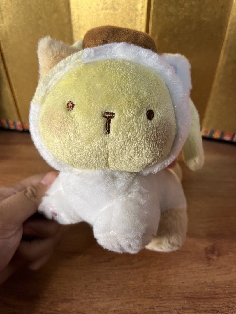 Original Sanrio Pompompurin Kitten Plush with Tag (Category: Plushies & Soft Toys) located in Gapan. Submitted by lunashop14 (Listing ID 1465156610, Image 3). Description: Original FuRyu Sanrio Pompompurin kitten plushie in pristine condition with original tags attached. Features a soft yellow and white design with a brown beret and pink bow. 100% authentic and super huggable. Perfect for collectors and gift-giving!.