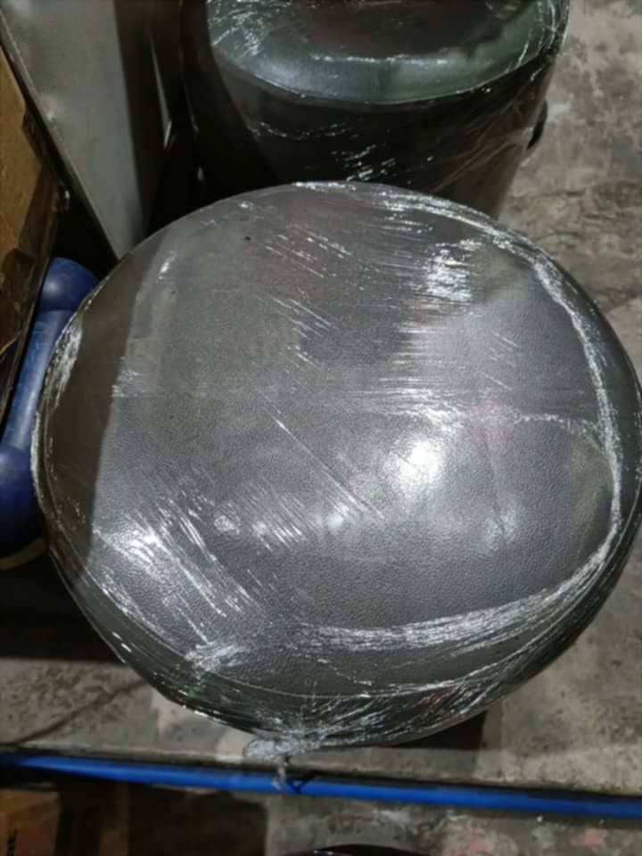 Ottoman Stool Chair (Category: Chairs) located in Manila. Submitted by grlfncs.mon31 (Listing ID 1465084881, Image 3). Description: - Dark grey faux leather round stool - Soft padded top for comfortable seating - Compact cylinder shape, easy to tuck under desks or in corners - Multiple units available for purchase.