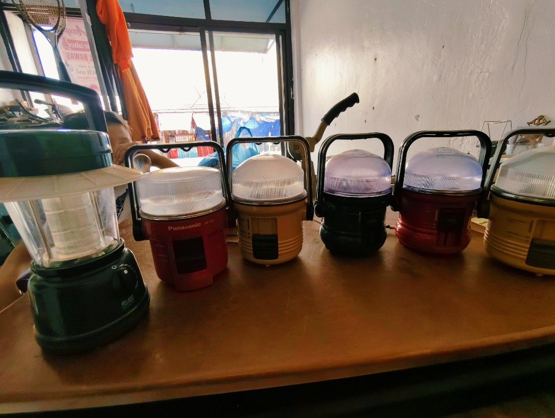 Panasonic BF-151 Portable LED Lantern Camping Light (Category: Lighting) located in Bulacan. Submitted by babz30261 (Listing ID 1465081145, Image 1). Description: - Bundle of multi-color portable camping and utility lanterns - Includes a reliable Panasonic BF-151 model in red, plus yellow and black units tajw - Battery-operated for convenience and portability - Sturdy black carry handles on top of each unit for easy transport - Clear top covers d