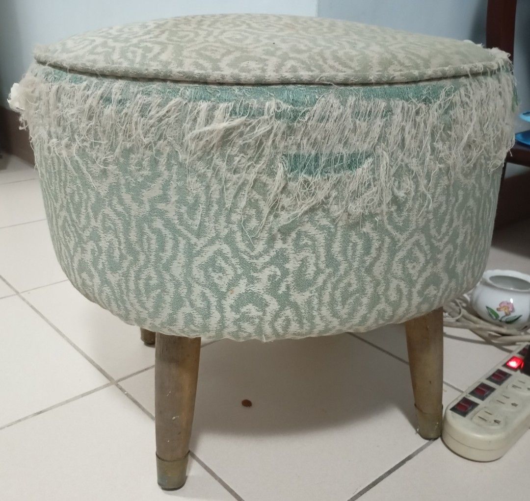 Patterned Fabric Round Footstool with Wooden Legs (Category: Chairs) located in Quezon City. Submitted by gdbye_things (Listing ID 1465083449, Image 2). Description: Just needs to be refurbished legs are very sturdy - Support: Four sturdy wooden legs and a solid internal structure - Condition: The fabric and structure are solid, but the fringed trim shows noticeable fraying all around - Note: Perfect and ready for a fun DIY upholstery project!.
