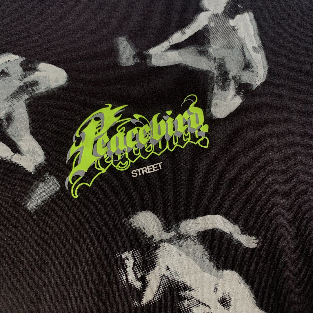 Peacebird Street All-Over Graphic Tee Black (Category: Tshirts & Polo Shirts ) located in Rizal. Submitted by shop_ms.lai (Listing ID 1464971429, Image 2). Description: - Brand: Peacebird Street - Color: Black with all-over action figure graphic print - Details: Small neon green & grey logo text on chest, crew neckline, short sleeves - Fit: Regular fit, relaxed silhouette - Material: 100% composition (per fabric tag) - Condition: Excellent, clean