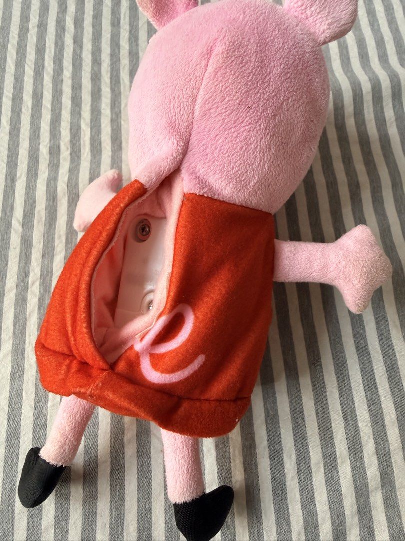 Peppa Pig Talking Plush Toy (Category: Plushies & Soft Toys) located in Quezon City. Submitted by orinds (Listing ID 1464978524, Image 2). Description: - Adorable Peppa Pig plush toy wearing her signature bright red dress - Soft and huggable fabric body with safe, embroidered facial features - Features an internal electronic sound compartment with a secure velcro on the back - Finished with cute black shoes - Great interactive toy for young child