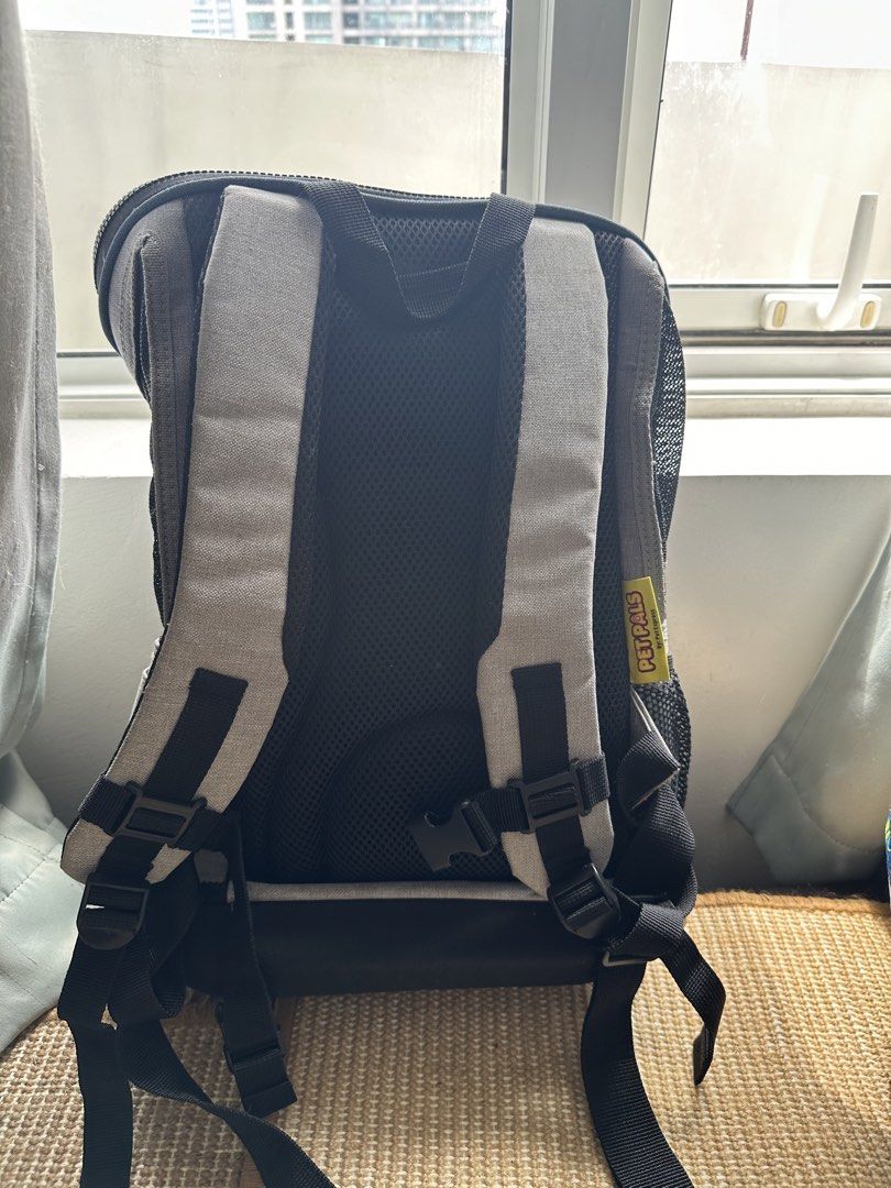 Pet Pals Grey Pet Carrier Backpack (Category: Homes & Other Pet Accessories) located in Mandaluyong City. Submitted by rustic_swirls (Listing ID 1464988384, Image 3). Description: - Brand: Pet Pals (sold at Pet Express) - Color: Grey - Features breathable mesh panels, padded shoulder straps, chest buckle, and top handle - Ideal for small cats and dogs - Price at Pet Express before was PHP 1900 - Has some signs of usage RFS: Sikip na yung dalawa k